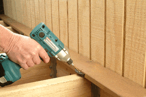The Eb-Ty, shown here, and the similar Ipe-Clip, are easy to install in slotted hardwood or composite decking.
