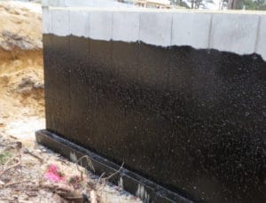 Dampproofing retards migration of water vapor through concrete and block walls.
