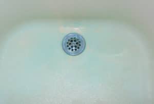 Blue deposits on plumbing fixtures are difficult to remove.