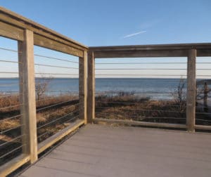 Site built cable railing systems can use wood posts and steel components.
