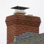 A chimney cap with screen keeps out moisture and animals and prevent embers from starting fires.