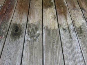 Wood decking cleaner removes stains and restores color