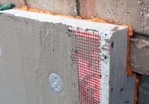 Detail for durable cement coating on foundation insulation