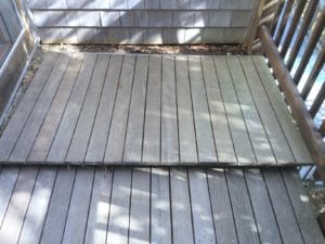 Hardwood decking weathers to silver gray if not refinished regularly.
