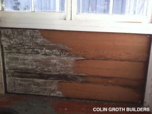Cleaning and sanding to restore redwood siding