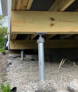 Adjustable top brackets make it easier to align helical piers with deck support beams.