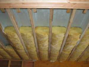 Flash and batt approach to insulating unvented cathedral ceiling